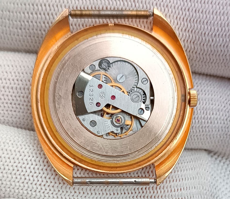 Slava 1809 small movement housed in a man's wristwatch, using spacers